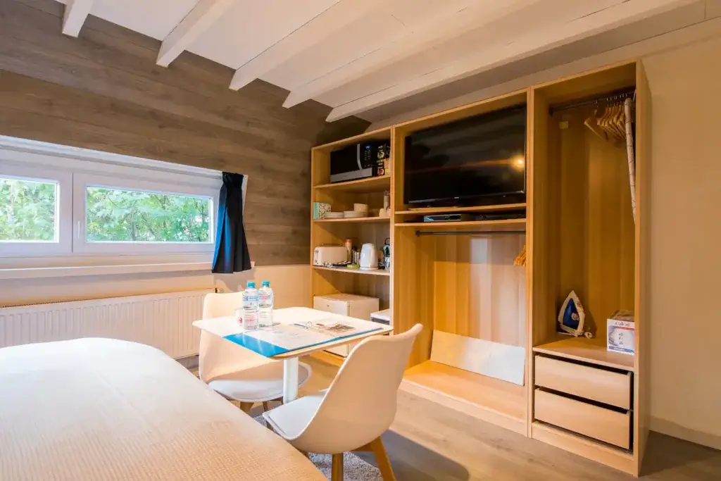 Bedroom with double bed and sitting area